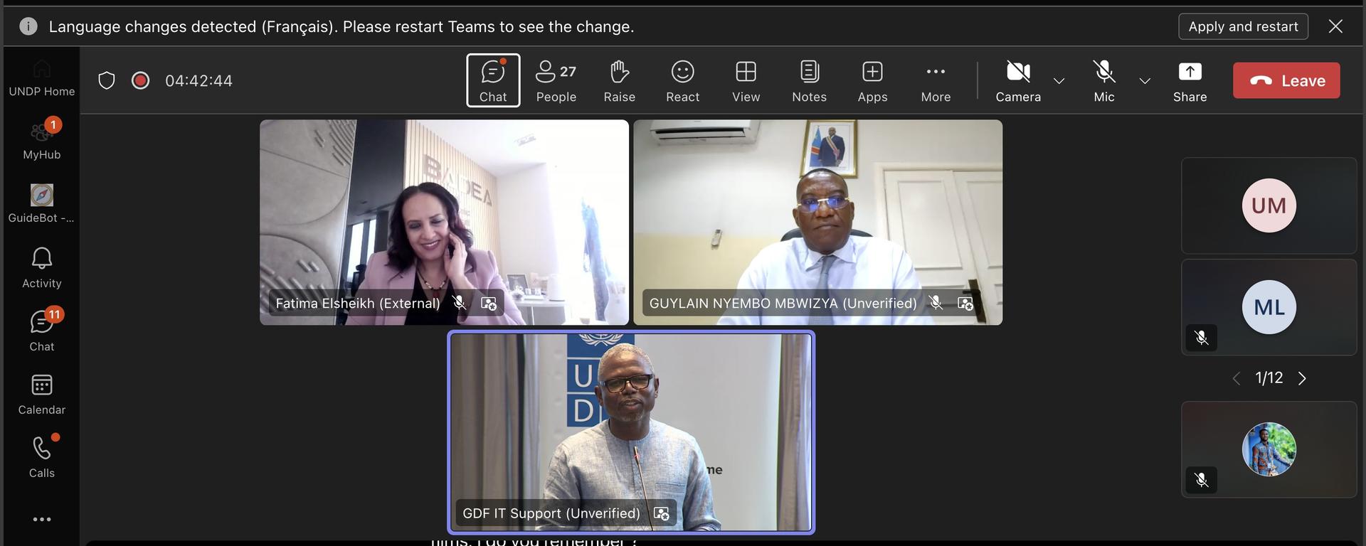 Three participants in a video call displayed in a grid on a dark interface.