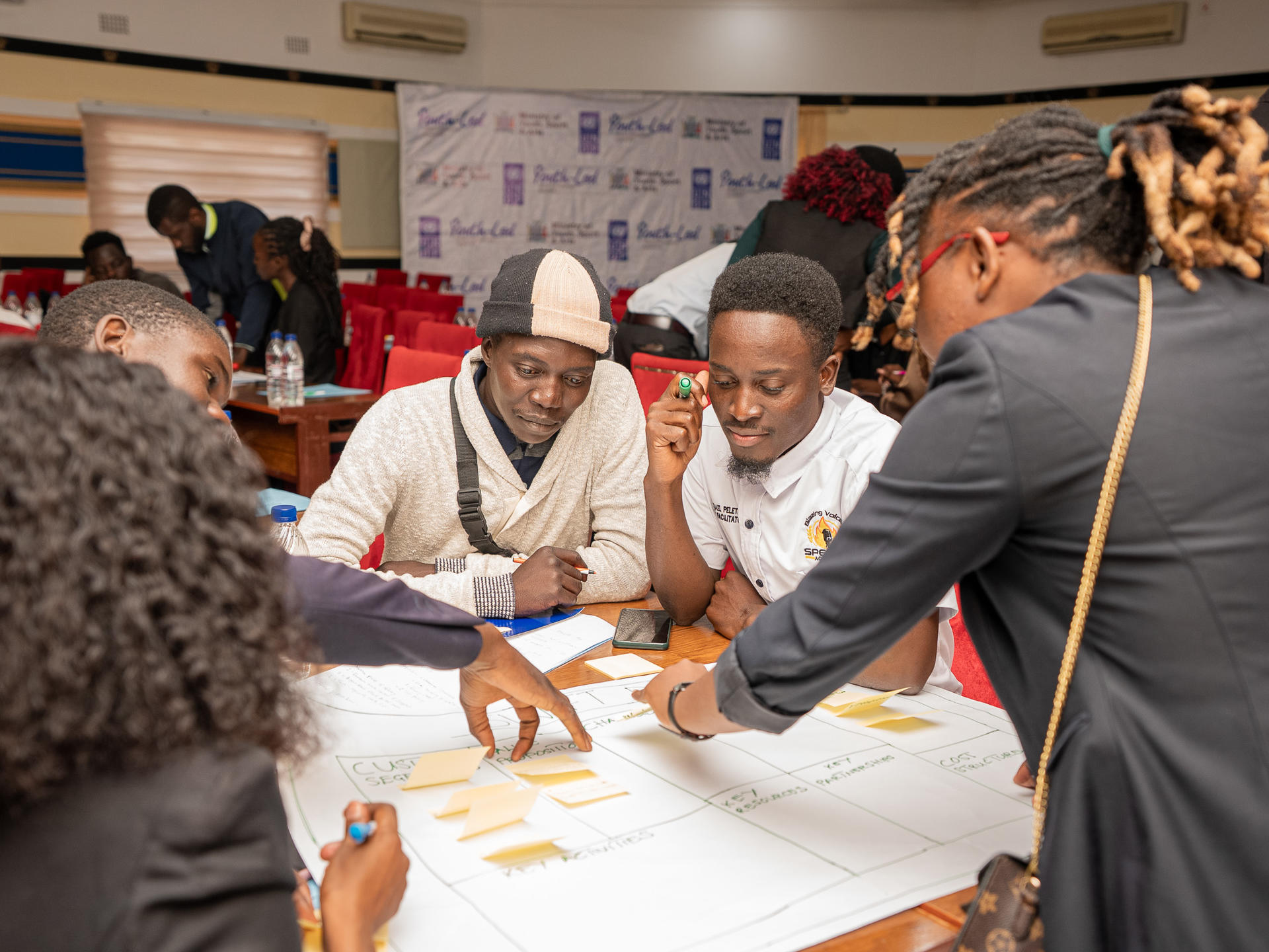 The attendees in a group discussing the training
