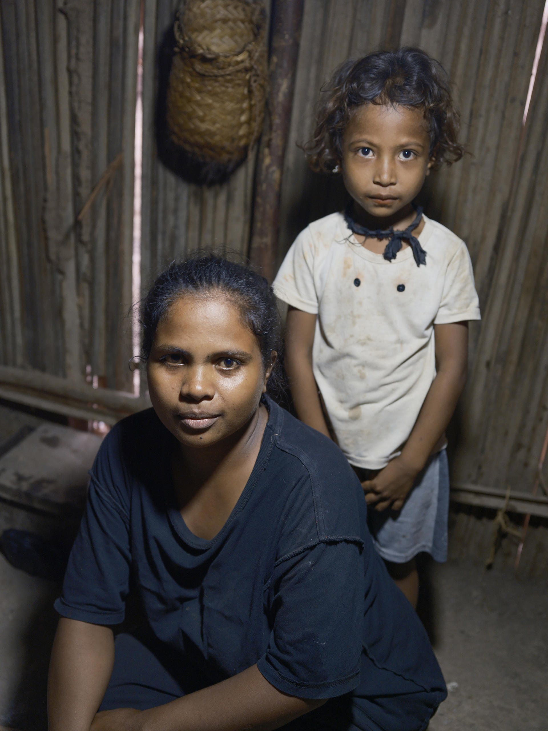 Elizinha Soares Campos and her daughter in their home in Uma Naruc, under the solar lanterns that transformed their evenings from darkness to possibility. | UNDP BRH/Kapil Das