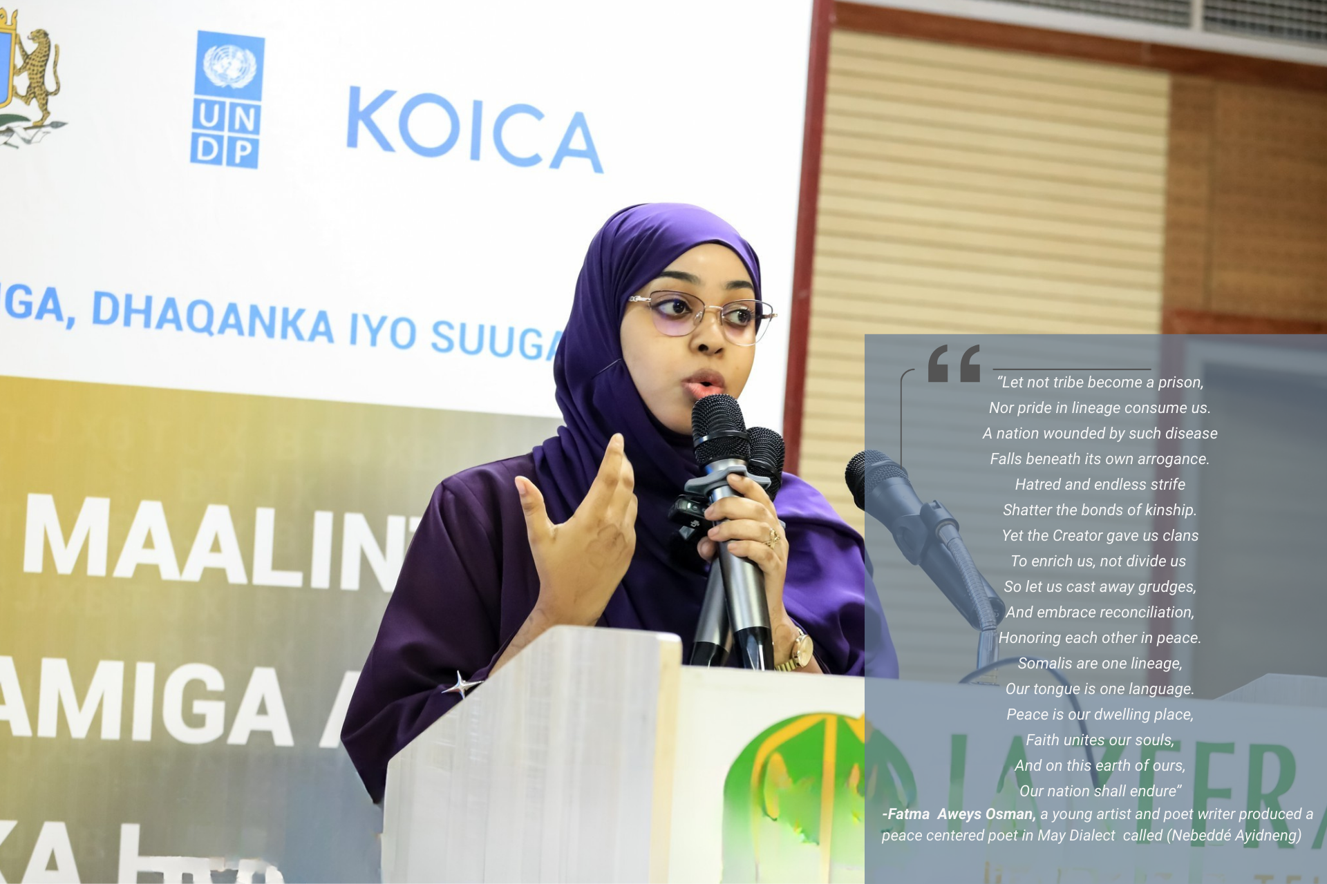 Speaker at a podium with microphone, KOICA banner in the background.