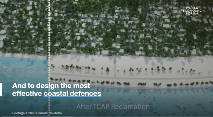 Aerial view of a green landscape with a blue caption banner at the bottom.