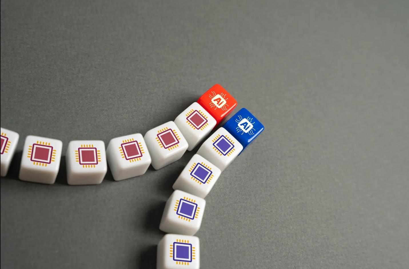 Row of small white tiles with red or blue centers, arranged in a curved line on a gray surface.