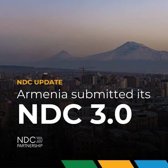 Graphic announcing Armenia submitted its NDC 3.0 over a cityscape with mountains; NDC Update.