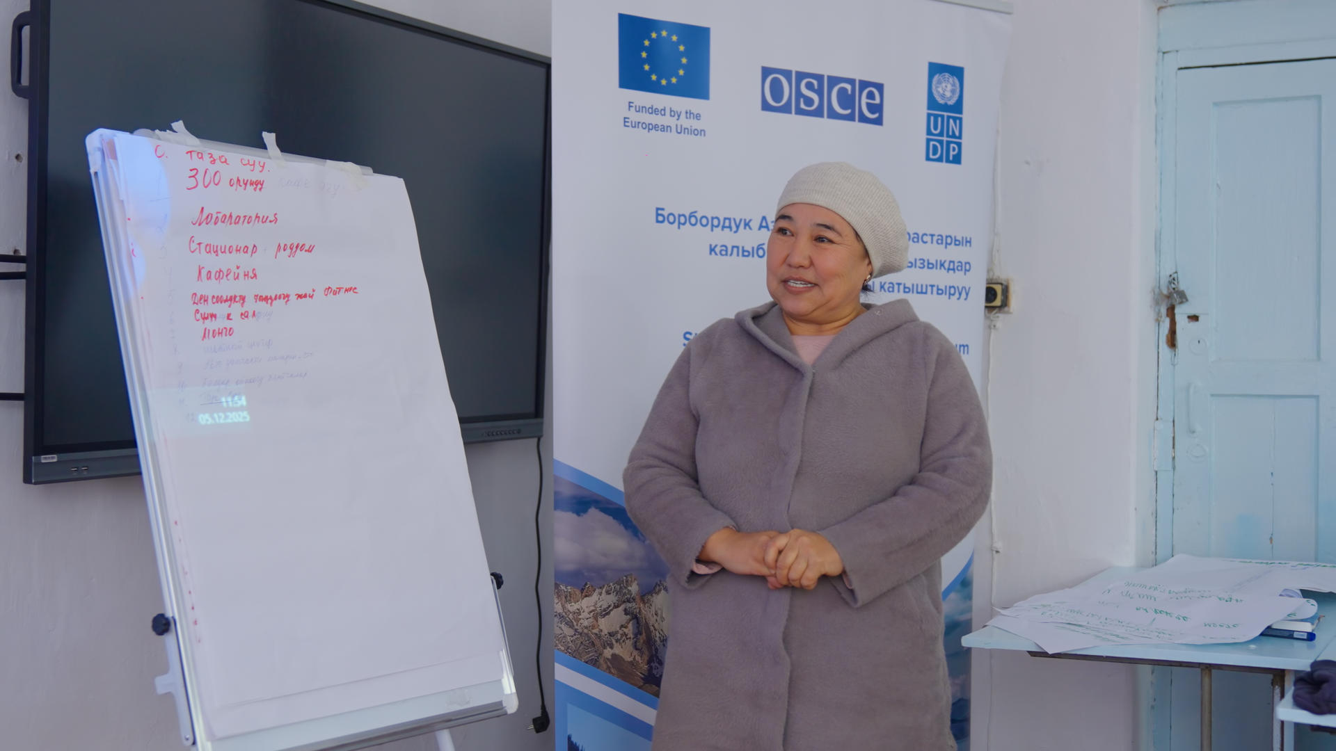 A women, workshop participant presents her findings 