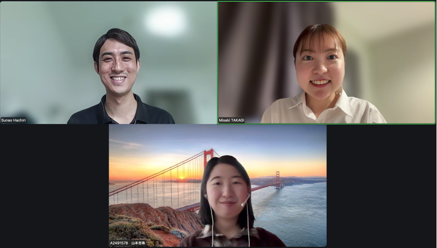 Video call with four windows; bottom-left shows a sunset over a rocky coastline.