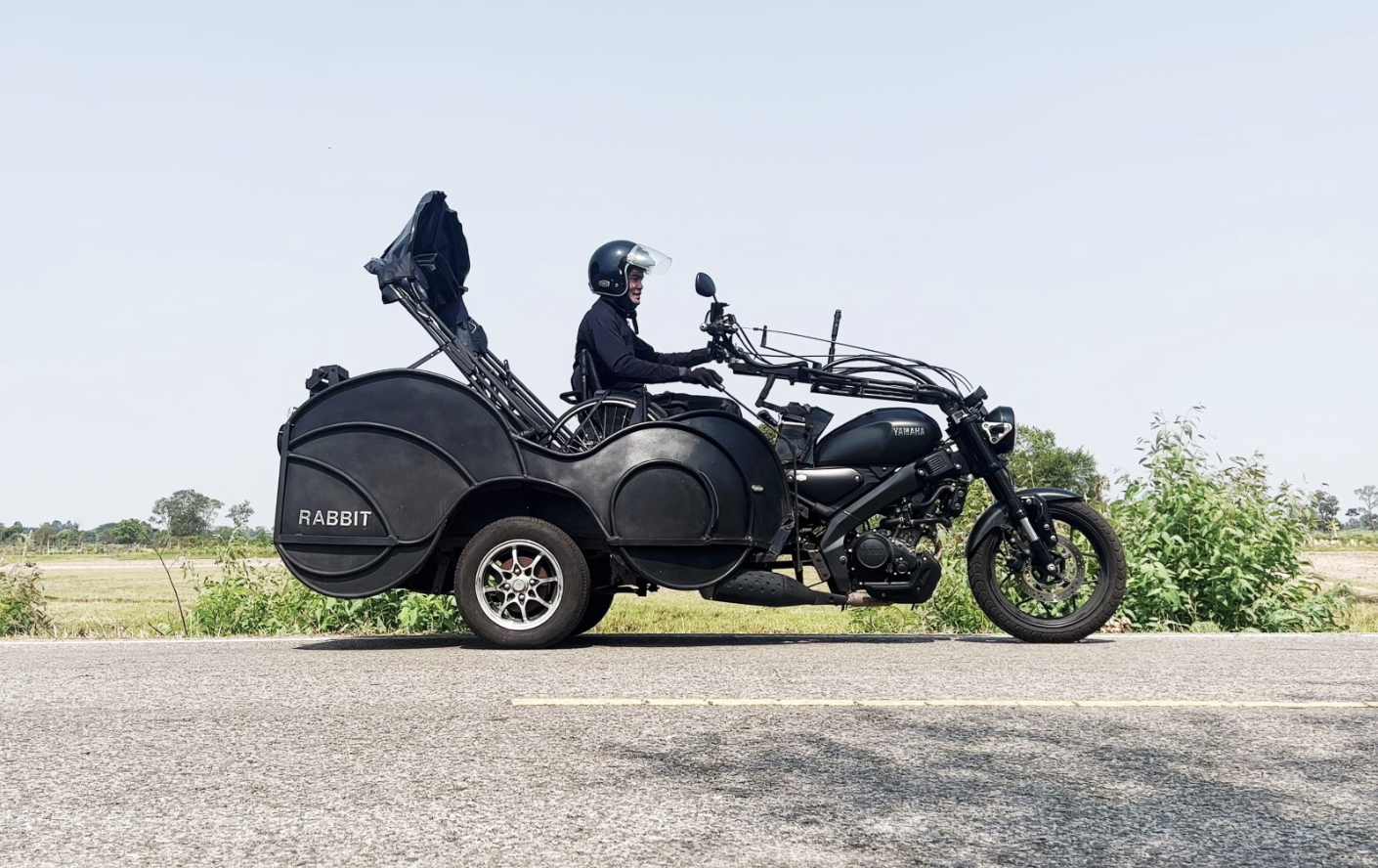 Namchok with his modified motorbike, Rabbit, which he designed and built with his brother for his daily commute