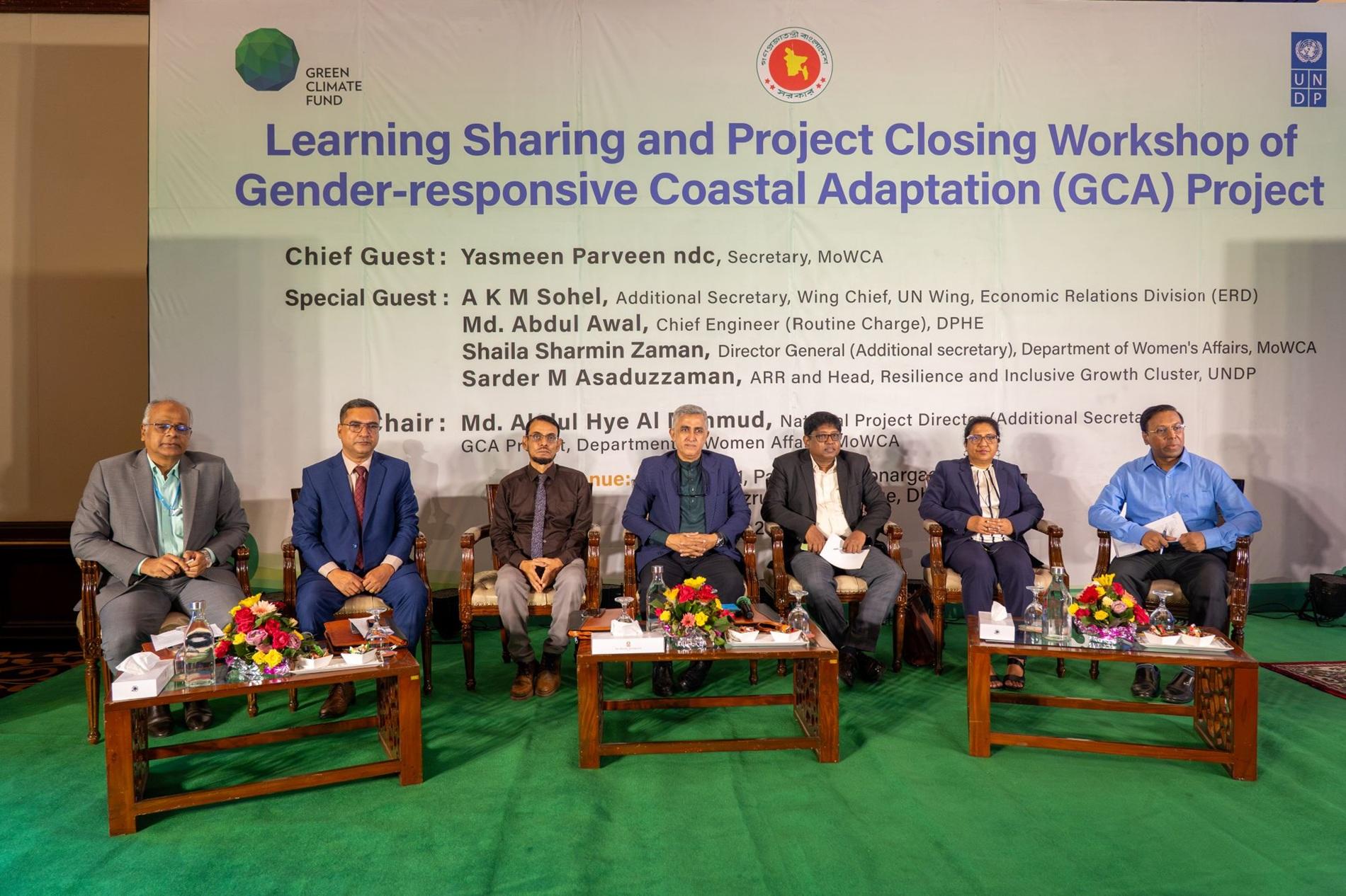 Panelists on stage at a workshop closing; banner for Gender-responsive Coastal Adaptation Project.