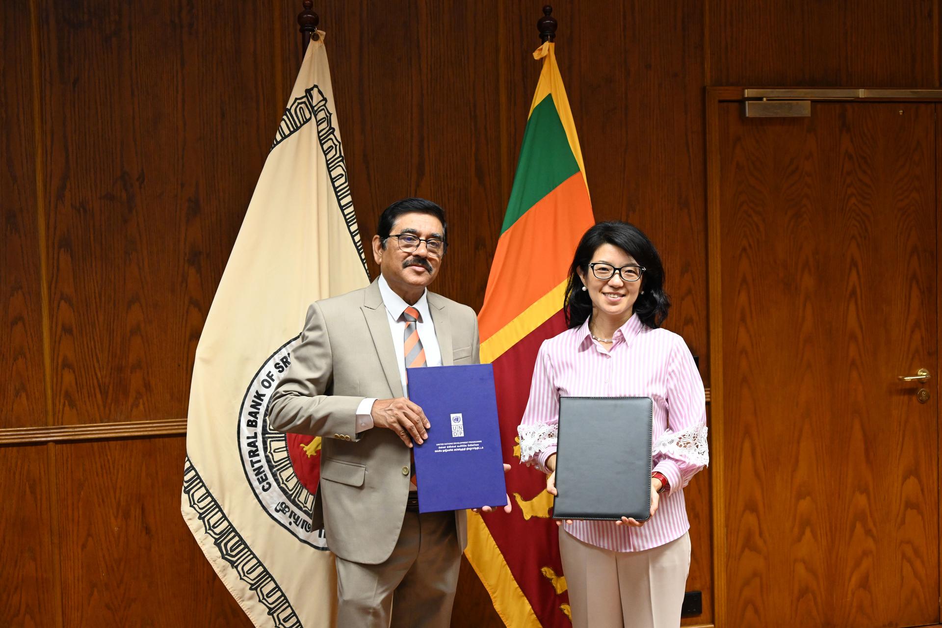Governor of CBSL and UNDP RR hold up agreement