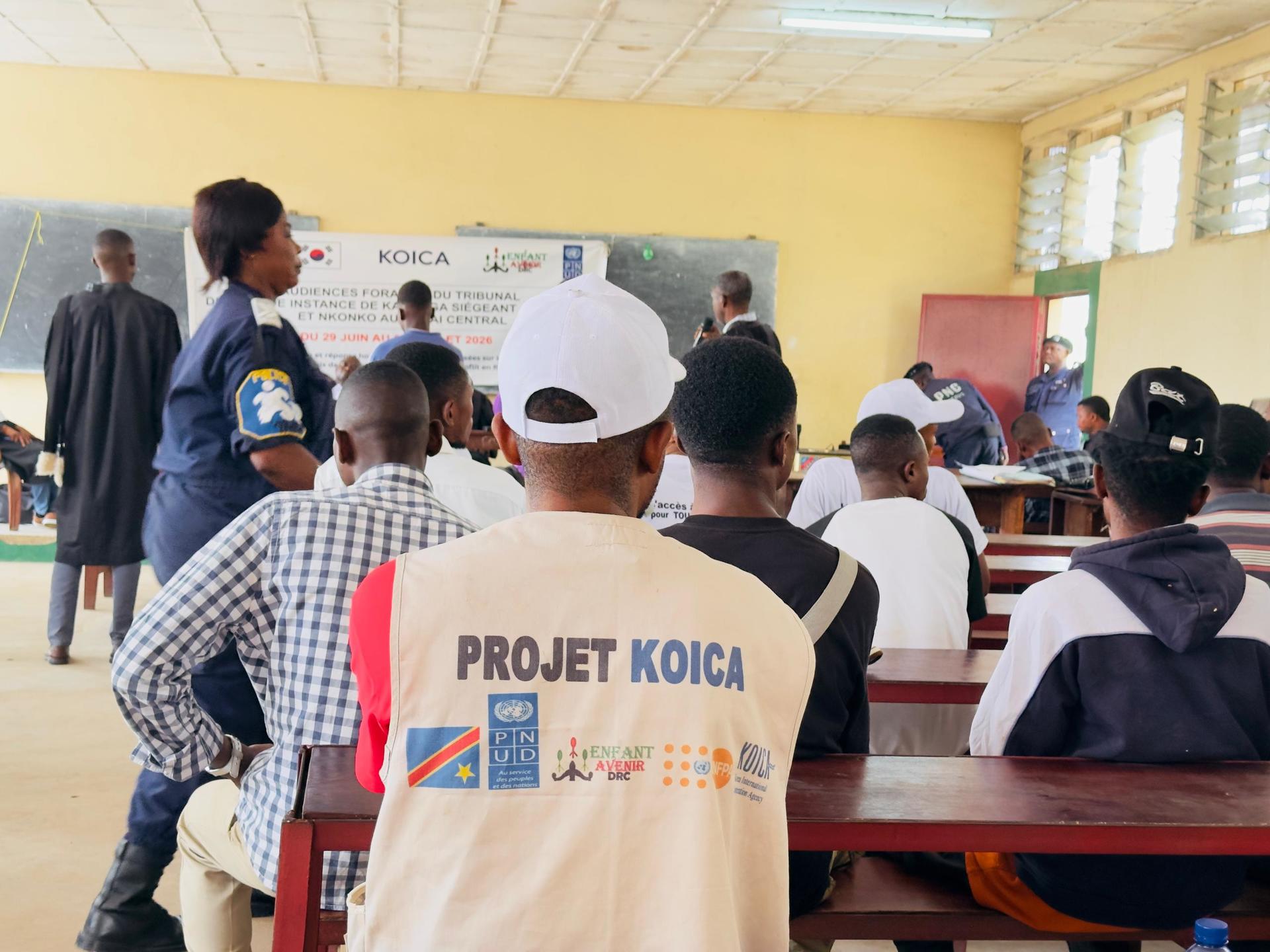 Photograph of a classroom training; foreground person wears a KOICA Project vest.