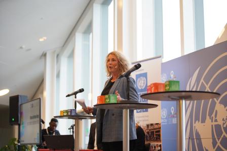 Woman speaking in front of audience