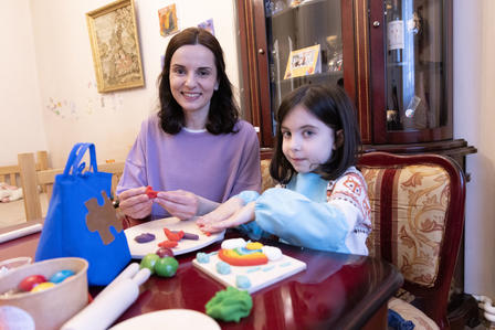 Madona and Liza molding the playdough