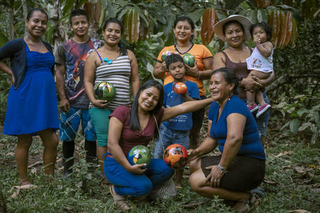 women grouped holding food