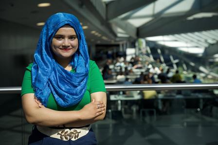 Saher Rashid poses in a conference room