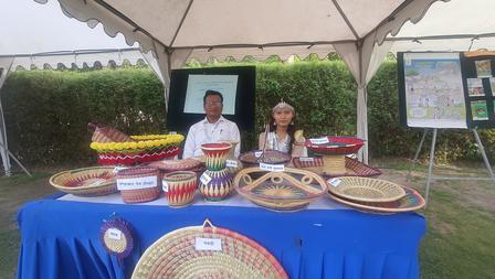 an indigenous woman at her stall