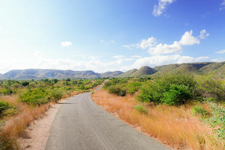 An image of a road in Rufunsa, surrounded by mountains