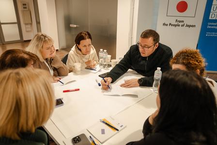 a group of people sitting at a table