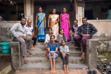 a group of people standing in front of a building