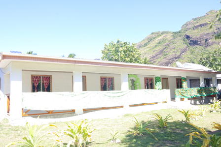 a house with a mountain in the background