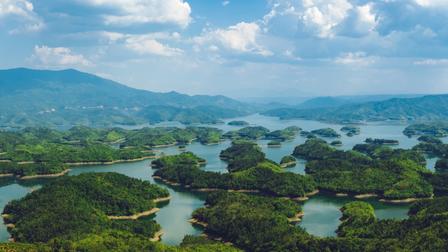 a view of a large body of water with a mountain in the background