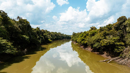 a person riding on top of a river
