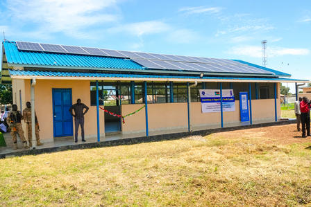 a group of people standing in front of a building