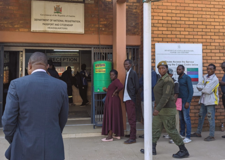 people lining up in front of a government office