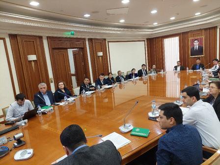 a group of people sitting at a table in a room