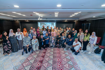 a group of people standing in a room
