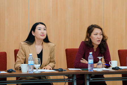 a group of people sitting at a table