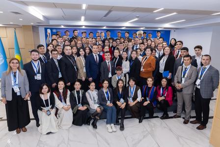 a group of people standing in front of a crowd posing for the camera
