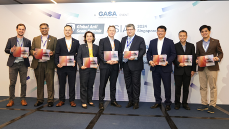Nine people on stage for the launch of the Anti-Scam Handbook