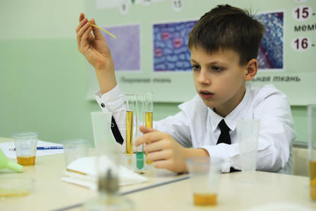 a young boy sitting at a table