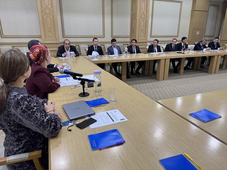 a group of people sitting at a table