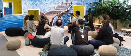 a group of people sitting on the floor