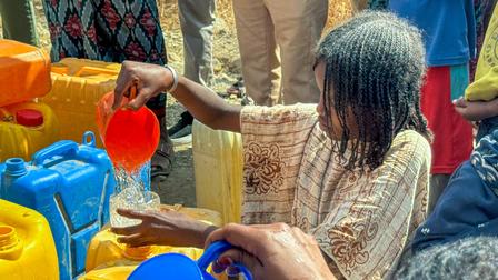 girl pouring water 