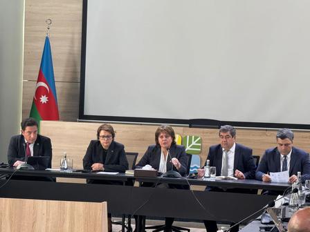 a group of people sitting at a table