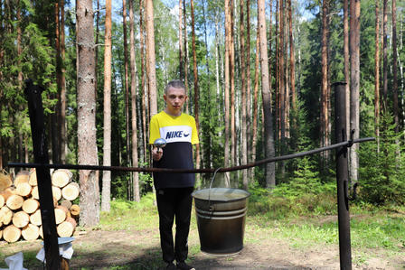 a person standing next to a tree