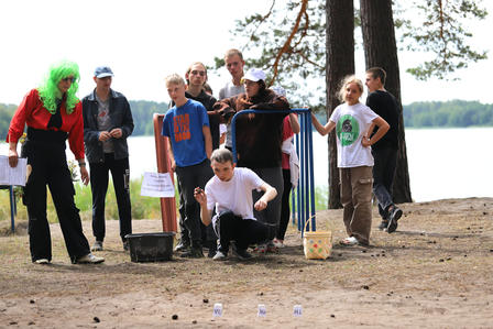 a group of people standing in front of a crowd posing for the camera