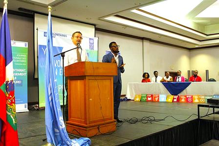 Xavier Michon, Representative resident of UNDP Haiti standing in front of a store