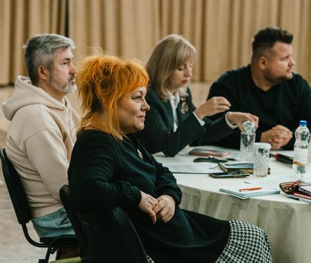 a group of people sitting at a table