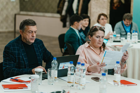 a group of people sitting at a table