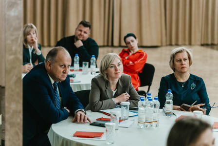 a group of people sitting at a table