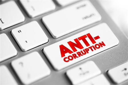 a close up of a keyboard with 'anti-corruption' key