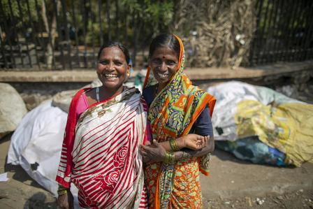 Two safai mitras standing