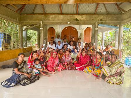 a group of people sitting posing for the camera