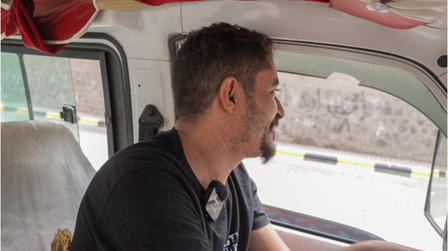 a man driving a car