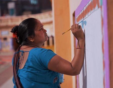 a person painting a wall