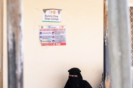 a somali woman with sign