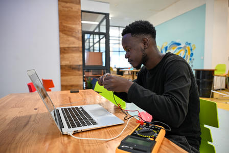 Khumbo Mindiera working at the UniPod in Malawi