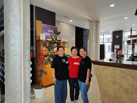 Three women at the lobby of the hotel